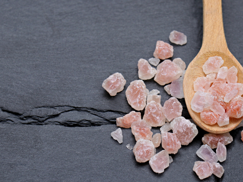Morning pink salt drink in a glass of warm water with Himalayan salt and lemon